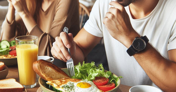 Thay đổi đơn giản trong bữa ăn sáng giúp giảm cân dễ dàng 1 an eating breakfast with bread and a woman eating breakfast with an omelette salad in a photo style 1 1729050805868645294687 39 0 611 915 crop 17290509331941536521877
